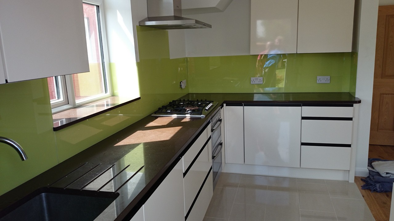 Lime green glass kitchen splashback installed by Pinner glaziers